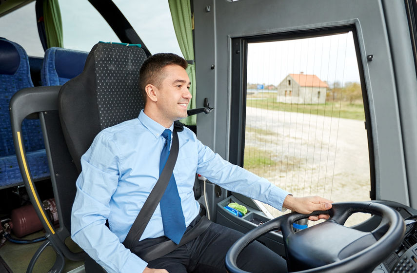 man safely operating coach bus